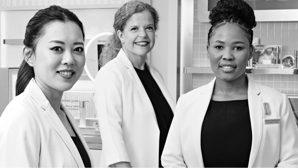 black and white photo of consultants in white coat